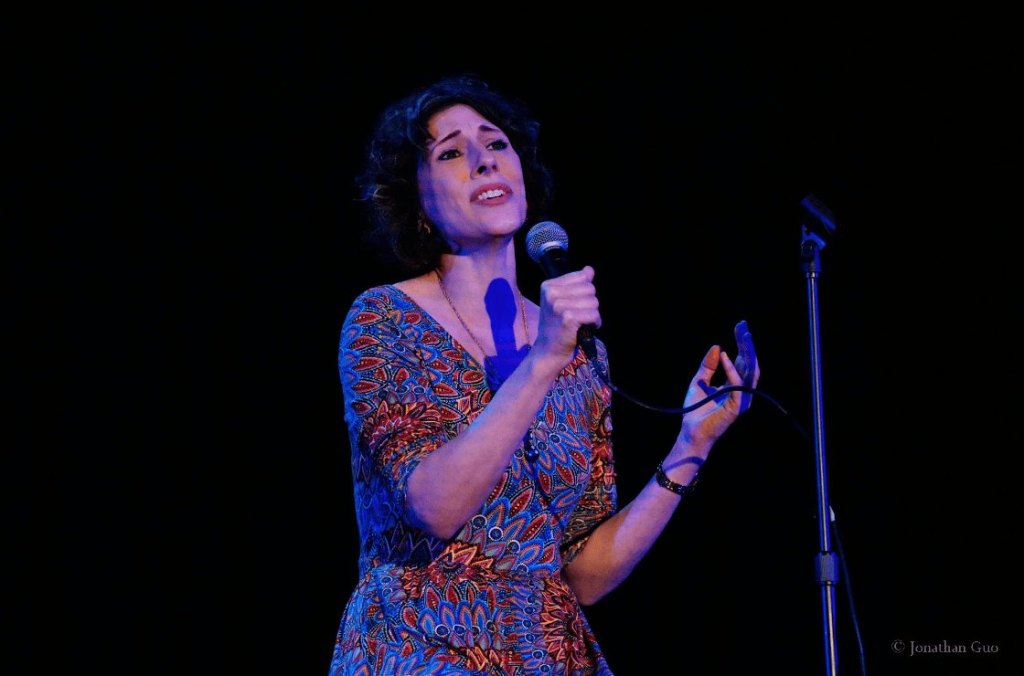 A teacher singing at the talent show